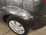 a close up of a car that has been dented