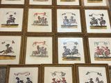 many framed pictures of horses and riders on the floor