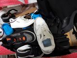 many pairs of shoes that are sitting in a suitcase