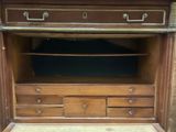 a wooden cabinet with drawers and drawers on it