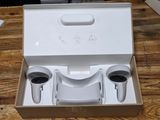 a box with two cups in it sitting on a table