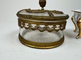 a glass box with a gold owl on top of it