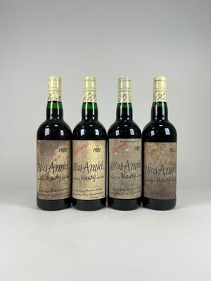 four bottles of wine sitting on top of a white surface