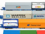 a lot of toy train cars that are on the tracks