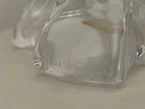 a clear glass vase with a gold fish inside of it