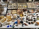 many different types of rocks and minerals on the table