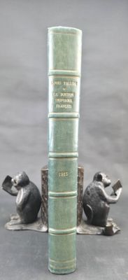 two figurines of mice and a book on a table
