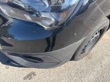 a close up of a car ' s headlight and front bumper