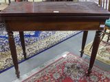 a wooden table with a small drawer on top of it