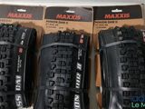 three maxxis mountain bike tires are on display in a box