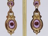 pair of gold and amethorate earrings with amethorates