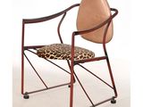 a chair that has a leopard print seat on it