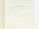 a close up of a book with a handwritten note on it