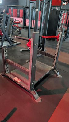 an image of a gym room with a row of exercise equipment