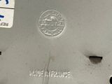 a close up of a metal object with a sticker on it