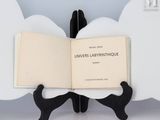 a book that is sitting on a book stand