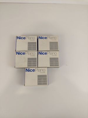 four boxes of nice piano piano paper sitting on top of a white table