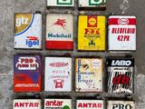 a lot of different types of gas cans on the ground