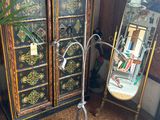a tall cabinet with a mirror and a mirror on it