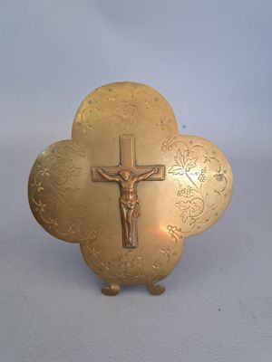 a gold cross with a crucifix on it
