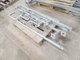 a lot of metal and wood pallets on the ground