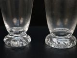 two glasses that are sitting on a table