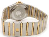 a close up of a watch on a white surface with a white background