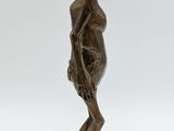 an image of a bronze statue of a woman with a basket on her head