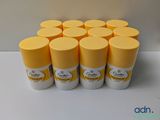 six bottles of lip butter sitting on top of a white table
