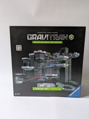 the box is open to show the model of a futuristic city