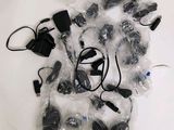 many different types of electronics wrapped in plastic on a table