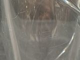 a glass with a cigarette in it sitting on a table