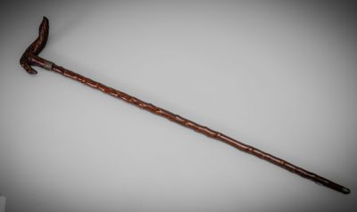an old wooden stick with a long handle on a white background
