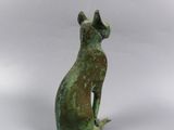 bronze statue of a cat sitting on its hind legs