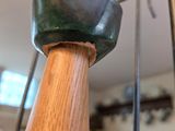 a close up of a wooden object on a stand