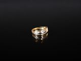an image of a gold ring on a black surface