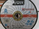 a close up of a grinding wheel on a table next to a box