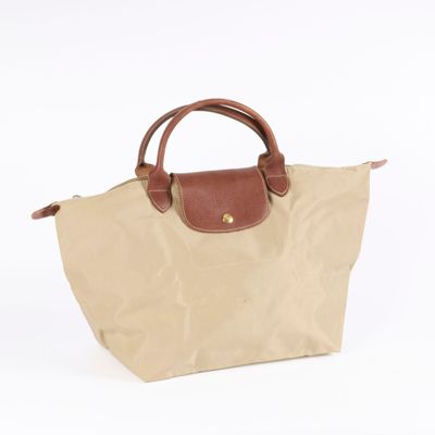 the longchamp bag in beige with brown handles