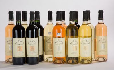 several bottles of wine are lined up in a row on a table