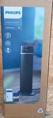 philips air purifier in the box on a wooden surface