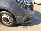 a close up of the front of a car that has been dented