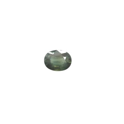 a close up of a green tourmaline stone on a white background