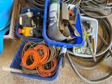 a blue container filled with electrical equipment on the floor