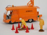 a toy truck that has a man on top of it