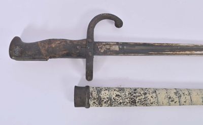 two old swords that are on display on a white surface