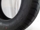 a close up of a tire on a white surface with a white background