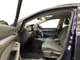 the interior of a car with the door open showing the driver ' s seat