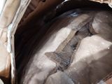 a box with a piece of wood in it that is wrapped in plastic