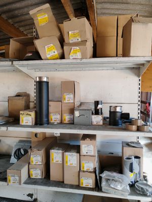 many boxes and boxes on the shelves in the garage