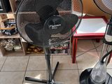 two fans that are sitting on the floor next to each other